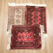Three Turkoman rugs, Afghanistan, each approximately 77 cm x 51 cm.