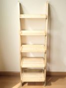 A modern pine effect waterfall bookcase, width 61 cm.