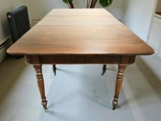 A Victorian mahogany extending dining table, with leaf, overall 218 cm x 114 cm x 73 cm.