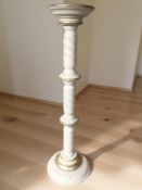 A painted and gilt turned wooden torchere, height 97 cm.