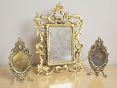 A Rococo style gilt metal easel mirrored frame, height 28 cm.