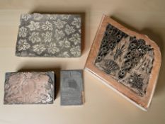 Four 19th century wood and metal printing blocks, one depicting the royal coat of arms.