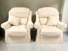 A contemporary pair of armchairs in beige upholstery, width 97 cm.