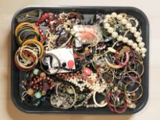 A quantity of costume jewellery, beads, bangles,