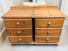 A pair of contemporary pine three drawer bedside chests, width 49 cm.