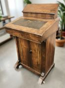 A Victorian figured walnut and satinwood inlaid Davenport, width 54 cm.