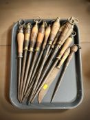 A group of antique steel knife sharpening tools and a further knife