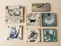 A group of decorative ceramic tiles, the largest 20 cm x 20 cm.