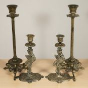 A pair of Regency brass candlesticks, raised on hoof feet,