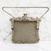 A white metal mesh evening purse, stamped 'Silver' and '83' to interior,