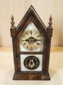 A late 19th century alarm mantel clock