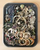 A quantity of costume jewellery, bangles, necklaces,