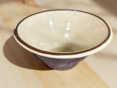 A large earthenware mixing bowl, diameter 51 cm.