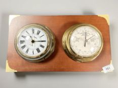 A reproduction brass ship's quartz timepiece and barometer, mounted on board, width 37 cm.