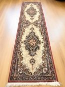 A machine made runner of Iranian Tabriz design, 370 cm x 90 cm.