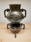 A Japanese Meiji period bronze twin-handled Koro,