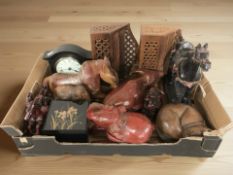 A group of eastern carved wooden and resin animal figures, two hardwood letter racks,
