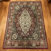 A machine made rug of Iranian design, 190 cm x 133 cm.