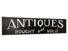 A contemporary painted sign 'Antiques Bought and Sold', 121 cm x 30 cm.