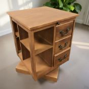 A reproduction revolving book table, width 48 cm.