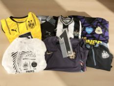 A group of Newcastle United and Newcastle Falcons football and rugby shirts.