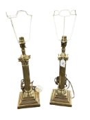 A pair of brass Corinthian column lamp bases, height 54 cm including fittings.