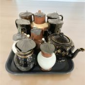 A group of 19th century pottery and lustre ware jugs and teapots