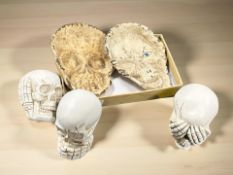 A group of pottery skulls and skull dishes