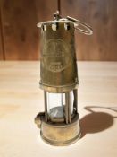 A brass Eccles Type 6 miner's lamp