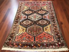 A Bakhtiari rug, West Iran, 207 cm x 142 cm.