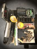 A collection of power tools and hardware to include a Hitachi circular saw, drill bit set,