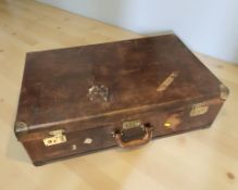 An early 20th century stitched brown leather luggage case, width 80 cm.