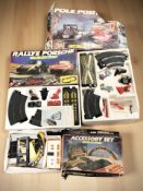 A group of Scalextric racing sets (packaging as found)