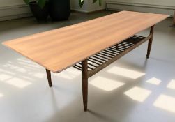 A teak rectangular coffee table, length 160 cm.