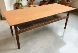 A teak rectangular coffee table, length 116 cm.