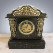A Victorian black slate and brass mantel clock,