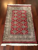 A Lahore Bokhara rug, Pakistan, 205 cm x 127 cm.