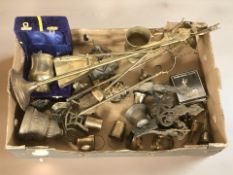 A box of brass wares including fire companion set, brass bells,