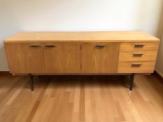 A 20th century teak low sideboard, 183 cm x 47 cm x 75 cm.