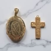 An antique yellow metal oval locket pendant together with a crucifix pendant.