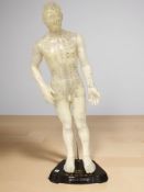 A small mannequin on stand, height 53 cm.