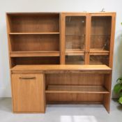 Three teak bookcase sections, the largest 140 cm wide.
