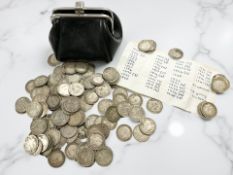 A small leather coin purse of containing Victorian-George V three pence pieces CONDITION