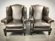 A pair of contemporary wingback armchairs,
