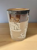 A Doulton Lambeth ware beaker with silver rim,
