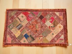 A Contemporary Indian terracotts coloured throw, with elaborate sequin and bead decoration,