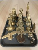 A group of brass ornaments, miner's lamp, candlesticks,