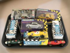 A group of Scalectrix cars with boxes