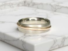 A gent's titanium and gold band ring,