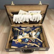 A masonic briefcase and contents to include various regalia and decorations,